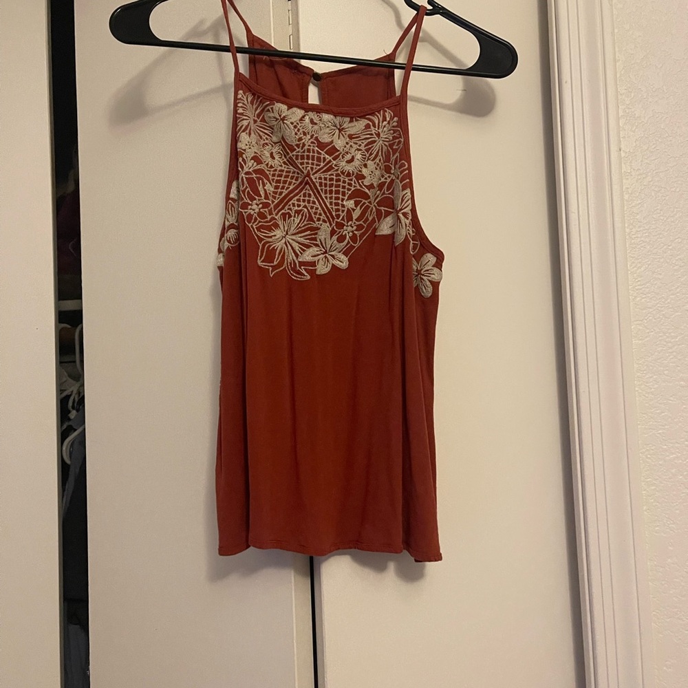Burnt orange tank top with floral design
